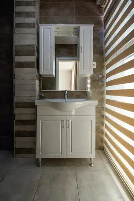 a bathroom with a white sink and a mirror at Adria Lux Apartments Sveti Stefan in Budva