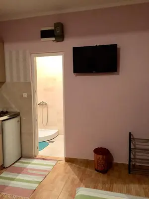 a living room with a flat screen tv on the wall at Apartmani Milanovic Susanj in Bar