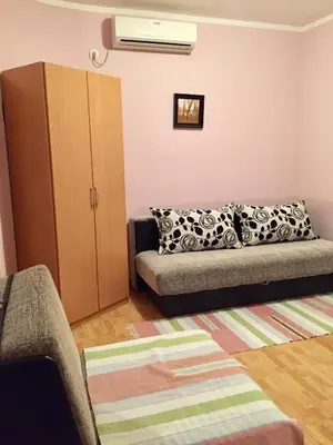 a living room with a couch and a cabinet at Apartmani Milanovic Susanj in Bar