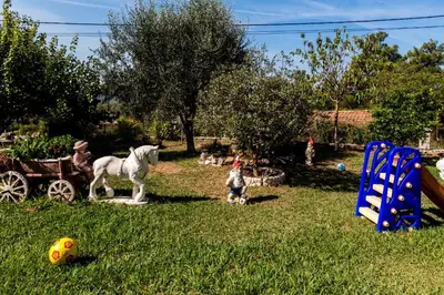 a statue of a horse standing in a yard at Sunny Nest Apartments in Kotor