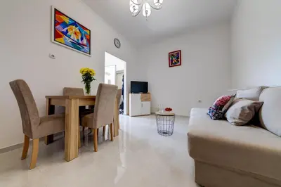 a living room with a couch and a table at Sunny Nest Apartments in Kotor