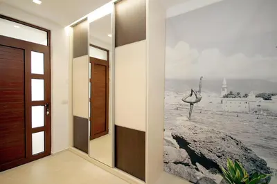 a hallway with a painting on the wall at Apartments Ardura in Petrovac na Moru