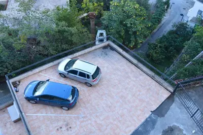 two cars parked on top of a roof at Seaview Paradise Apartment in Budva