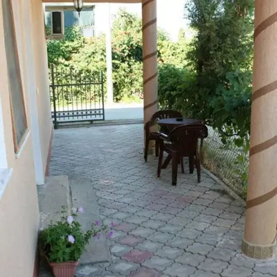 a patio with two chairs and a table at Apartments EMERALD in Ulcinj