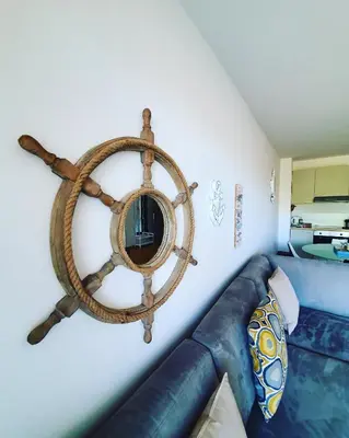 a room with a couch and a mirror on the wall at Charming apartment near beach in Sveti Stefan