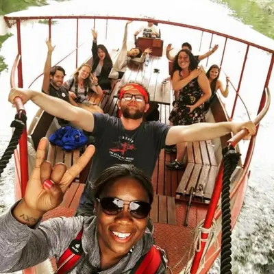 a group of people on a boat in the water at Old Town Youth Hostel in Kotor