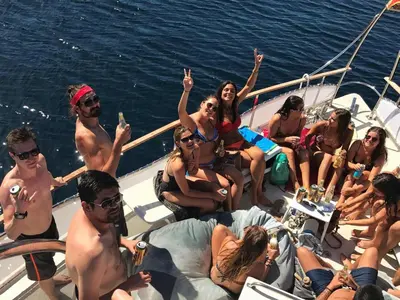 a group of people on a boat in the water at Old Town Youth Hostel in Kotor