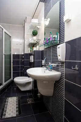 a bathroom with a sink and a toilet at SunSea Apartments in Budva