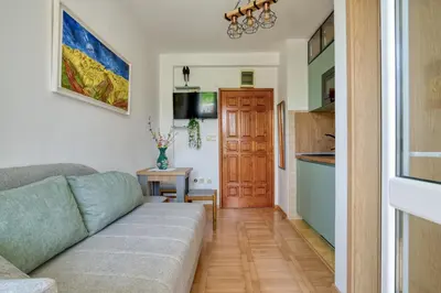 a living room with a couch and a kitchen at Apartments Elena in Budva