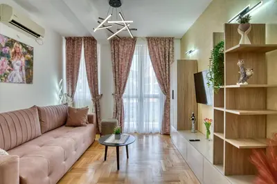 a living room with a couch and a table at Apartments Elena in Budva