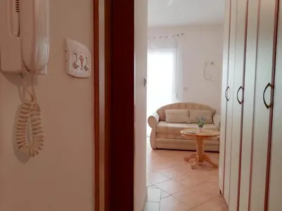 a living room with a couch and a table at Apartment Oleander of Budva in Budva
