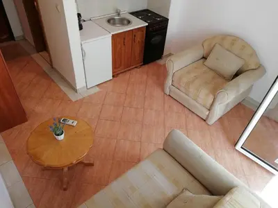 an overhead view of a living room with a table and chairs at Apartment Oleander of Budva in Budva
