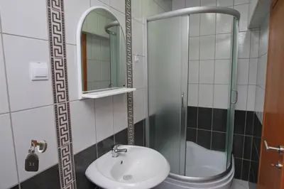 a bathroom with a sink and a shower at Villa Andjelina in Budva