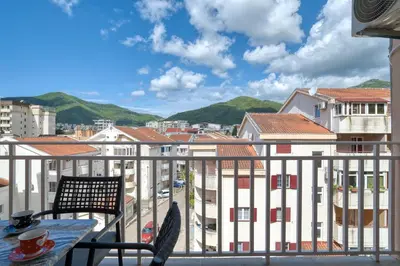 a view of a city from a balcony at COMFORT APARTMENT NEAR THE BEACH in Budva