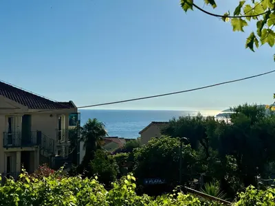 a view of the ocean from a house at Apartments Kentera LUX in Sveti Stefan