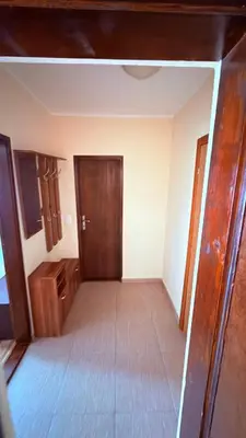 an empty room with a door and a wooden floor at Apartments HMD in Budva