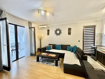 a living room with a bed and a couch at Apartments HMD in Budva