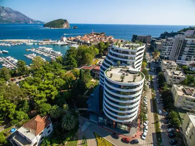 an aerial view of a large building next to the water at Royal Gardens Paradise in Budva