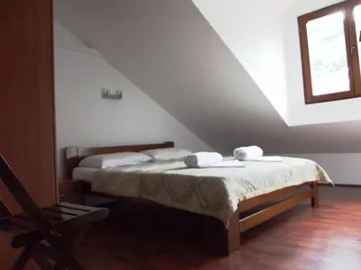 a bedroom with a bed with two towels on it at Apartments Budva Center in Budva