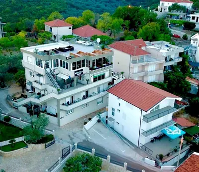 an aerial view of a large white building with a red roof at Apartments Tati in Ulcinj