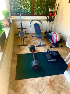 a room with a gym with exercise equipment on the floor at Apartments Tati in Ulcinj