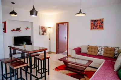a living room with a couch and a table at Peaceful City Center in Podgorica