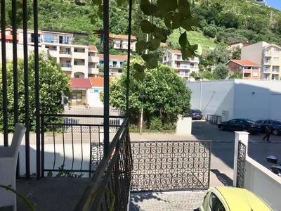 a balcony with a view of a street and buildings at Apartments Marković in Budva
