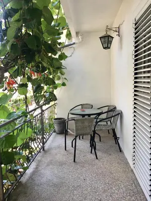 a patio with two chairs and a table on a balcony at Apartments Marković in Budva