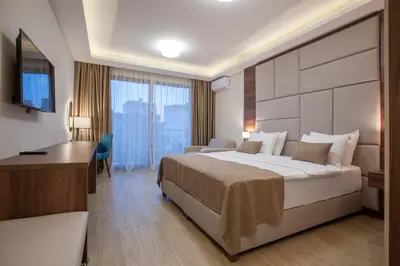 a hotel room with a bed and a desk at Hotel Twelve by Aycon in Budva
