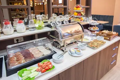 a buffet with many different types of food on a counter at Hotel Twelve by Aycon in Budva