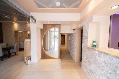 a mirror on the wall of a lobby at Azzuro apartments Budva in Budva