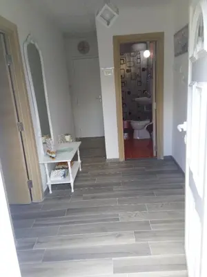 a hallway with a bathroom with a sink and a toilet at vicky 1 in Kotor