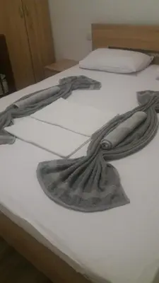 a drawing of a mermaid on a bed at Dalukos Apartmani in Sutomore