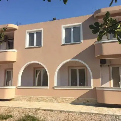 a building with arches and windows on it at Apartments Cindrak in Bar