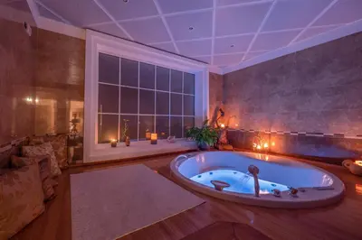 a large bathroom with a bath tub with a large window at Marinero Apartments in Budva