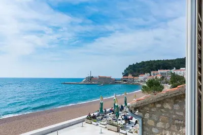 a view of a beach and the ocean at Apartments LIDO Petrovac in Petrovac na Moru