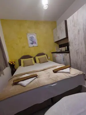 a bedroom with a large bed in a room at Apartments Blago Sutomore in Sutomore
