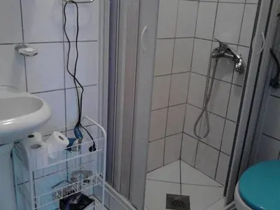 a bathroom with a shower and a sink at Stojko Rafailovici in Rafailovici