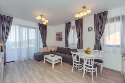 a living room with a couch and a table at Belvedere Apartments in Petrovac na Moru
