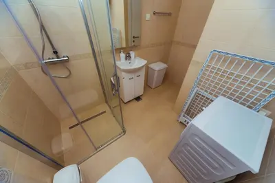 a bathroom with a shower and a toilet and a sink at Belvedere Apartments in Petrovac na Moru