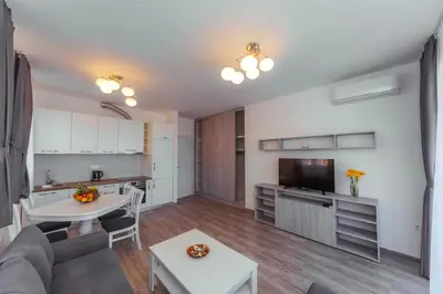 a living room with a couch and a table at Belvedere Apartments in Petrovac na Moru