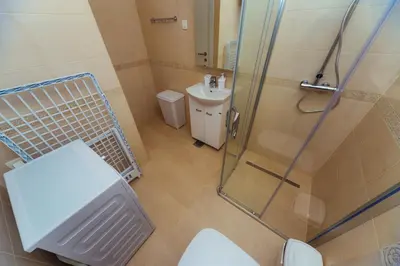 a bathroom with a shower and a toilet and a sink at Belvedere Apartments in Petrovac na Moru