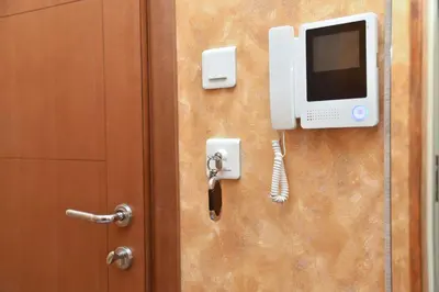 a door with a monitor and a phone on it at Apartment Golden Lavender in Budva