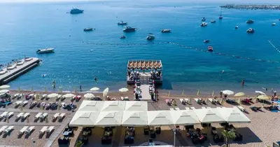 a view of a beach with boats in the water at Apartment Golden Lavender in Budva
