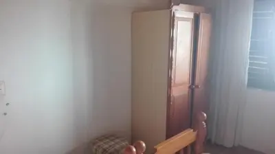a corner of a room with a wooden door at Holiday house Nebojsa in Bar