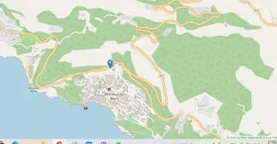 a map of a park with a red dot at Mum's Apartment in Petrovac na Moru