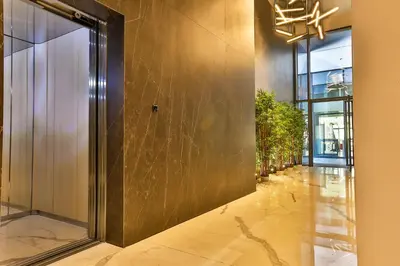 a hallway of a building with a elevator at Royal Montesun Apartments in Budva