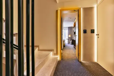 a hallway with stairs leading to a room at Hotel Kalos in Budva