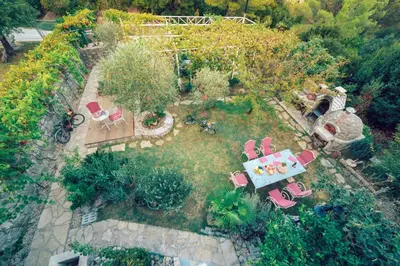 an aerial view of a garden with a table and chairs at Apartments Wild Beauty in Sutomore