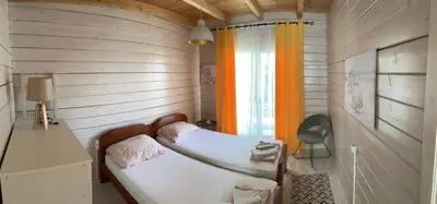 a small bedroom with a bed and a window at SeaStar Eco Villa in Utjeha